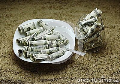 Money on the plate Stock Photo