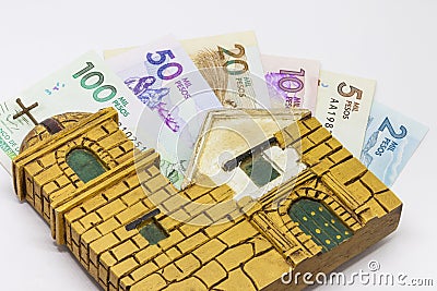 Money and religion Stock Photo