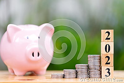 Money saving concept for new year 2023 with coins stacking Stock Photo