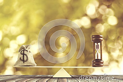 Money and Time balance, Change money into cash or reverse concept : US Dollar in sack bag, Hourglass put on scales on wood table Stock Photo