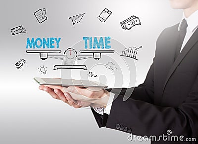 Money and Time Balance, young man holding a tablet computer Stock Photo