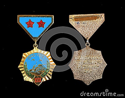 Mongolia - CIRCA 1975: Medal `30 years of victory over militaristic Japan`, isolated on black background Editorial Stock Photo