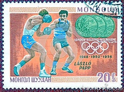 Postage stamp printed in Mongolia with a picture Triple champion of Laszlo Papp boxing, from the series `Olympic champion`. Editorial Stock Photo