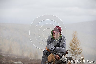 Mongolian nomad man in a countryside Stock Photo