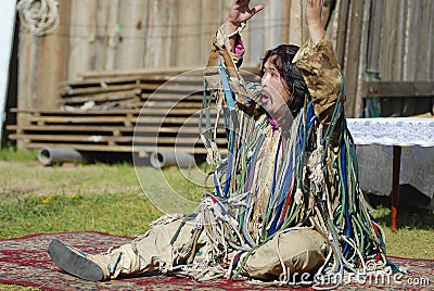 Mongolian shaman performs a ritual in Ulan Bator, Mongolia. Editorial Stock Photo