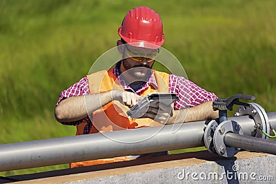 Monitor procces of filtering water, holding tablet Stock Photo