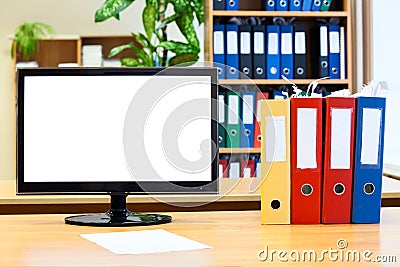 monitor screen and colored folders for papers Stock Photo