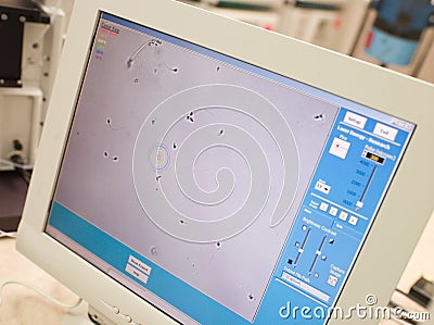 Monitor showing intra cytoplasmic sperm injection Stock Photo