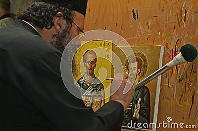 Monk being busy painting an icon in a Greek monastry Editorial Stock Photo