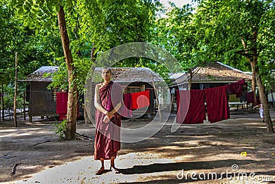 A monk in biggest Buddhism monarchy in Mandalay, Myanmar Editorial Stock Photo