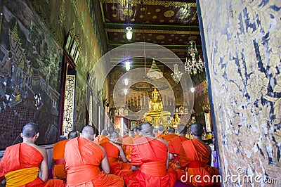 Monk and Buddhist worship Gold Buddha Editorial Stock Photo