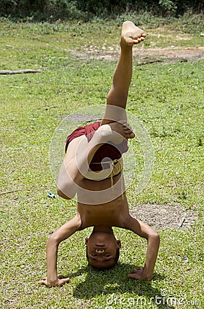 Monk child working on his handstands Editorial Stock Photo