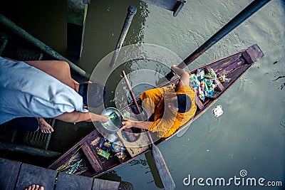 Monk Collecting Alms at Amphawa River Editorial Stock Photo