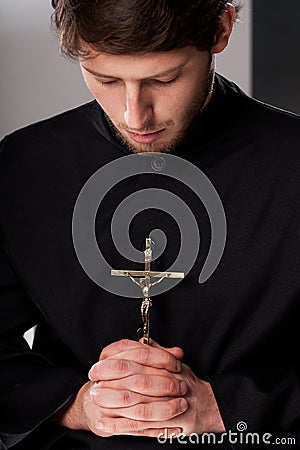 Monk with crucifix Stock Photo