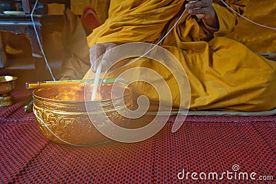 A monk prays with the holy water in the Buddhists Auspicious ceremony. Stock Photo