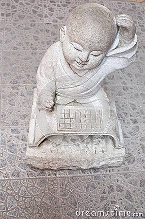 Monk Stone Statue Stock Photo