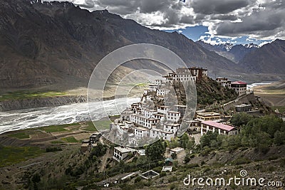 A monk taking picture of Kye monastery or ki monastery with his mobile Stock Photo