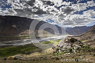 A monk taking picture of Kye monastery or ki monastery with his mobile Stock Photo