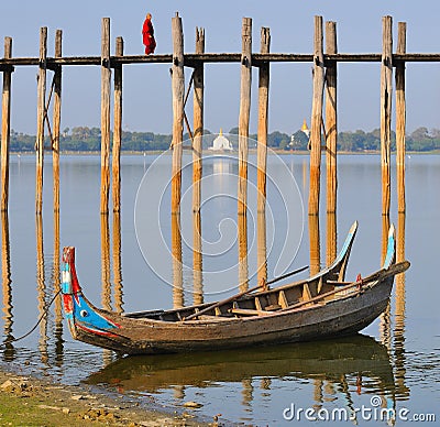 Monk walking across the ubain bridge in myanmar(bu Editorial Stock Photo