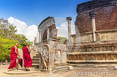 Monk walking in front of Vatadage Round House of Polonnaruwa ruin Unesco world heritage on Sri Lanka Editorial Stock Photo