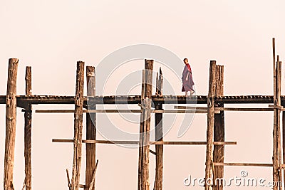 Monk walking on U-Bein bridge, in Amarapura, Mandalay, Burma Myanmar Editorial Stock Photo