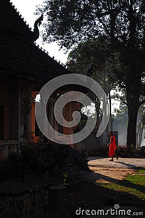 The monk at Wat Luang, Pakse, Laos Editorial Stock Photo