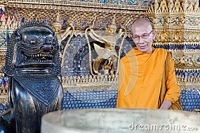 Monk at Wat Phra Kaew, Bangkok Editorial Stock Photo