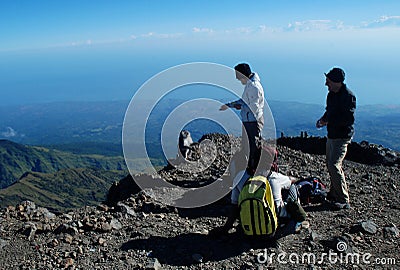 Monkey and climbers at mount Rinjani peak Editorial Stock Photo