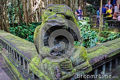 Monkey statue in Bali covered with moss Stock Photo