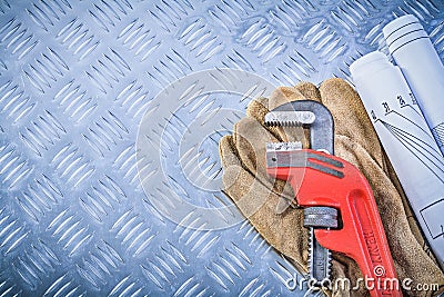 Monkey wrench blueprints leather protective gloves on grooved me Stock Photo