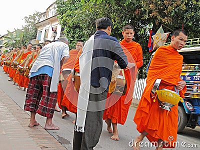 Monks collecting alms, Luang Prabang Editorial Stock Photo