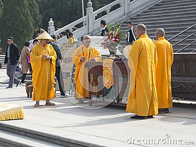 Monks at Nanshan tourist attraction, Bronze Buddha Statue Editorial Stock Photo