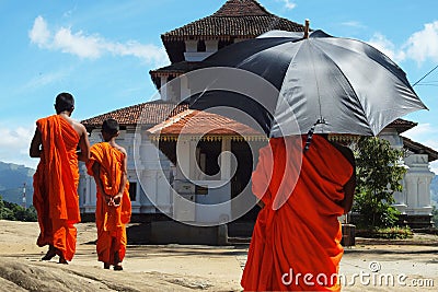 Monks with umbrella Editorial Stock Photo
