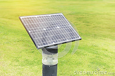 Mono crystalline silicon solar cells power outdoor lawn lamp ligh field on the green grass Stock Photo