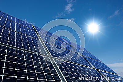 Mono-crystalline solar panels against a sunny sky Stock Photo