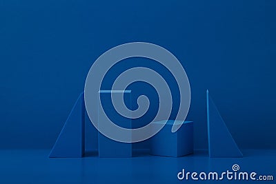 Monochromatic abstract still life with blue geometric figures on blue background with a space for text Stock Photo