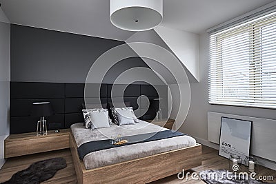 Monochrome bedroom with gray walls and lamps Editorial Stock Photo