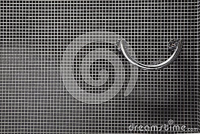 Monochrome bright grip in bath with black walls Stock Photo