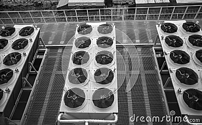 Monochrome photo of long rows of air conditioning systems Stock Photo