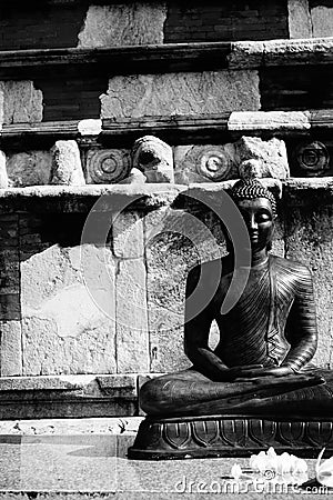 Monochrome photo of a statue of a lord buddha. Stock Photo