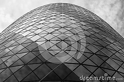 Monochrome photograph looking up at the iconic Gherkin Building, 30 St Mary Axe in the City of London, UK Stock Photo