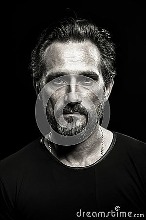 Monochrome portrait of strong mature beardy man. Stock Photo