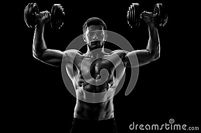 Monochrome shot of an athletic ripped young sportsman with dumbb Stock Photo