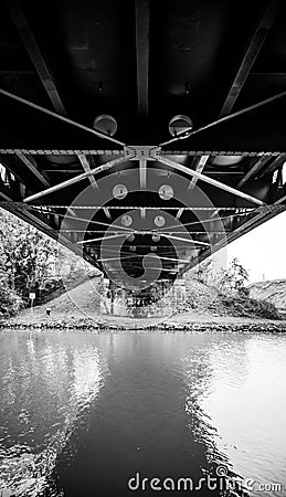 Monochrome shot of a bridge over the river Stock Photo