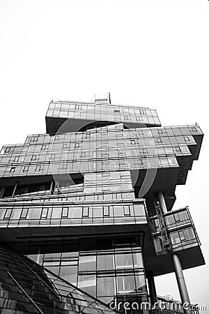 Monochrome shot of modern building against sky Stock Photo