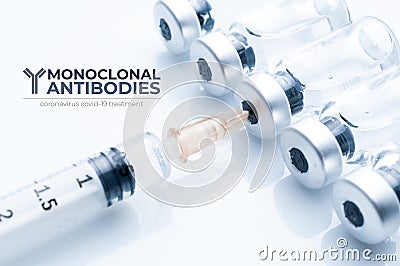 Monoclonal antibodies concept image: syringe draws liquid from a vial Stock Photo