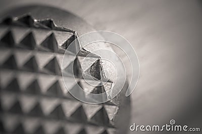 Monocrome macro shot of a wooden meat tenderizer, metal end Stock Photo