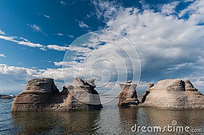 Monoliths on a cloudy sky in Mingan Stock Photo