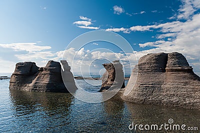 Monoliths under a beautiful blue sky in Mingan Stock Photo