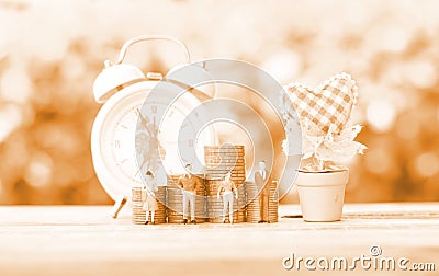 Monotone figure women and men with coins stacking alarm background , saving concept Stock Photo